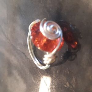 Silver and orange swirl ring